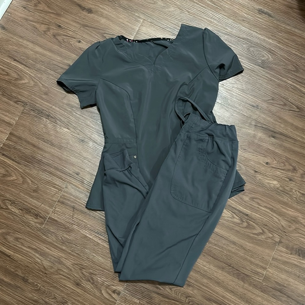 Gray Healing Hands scrubs.